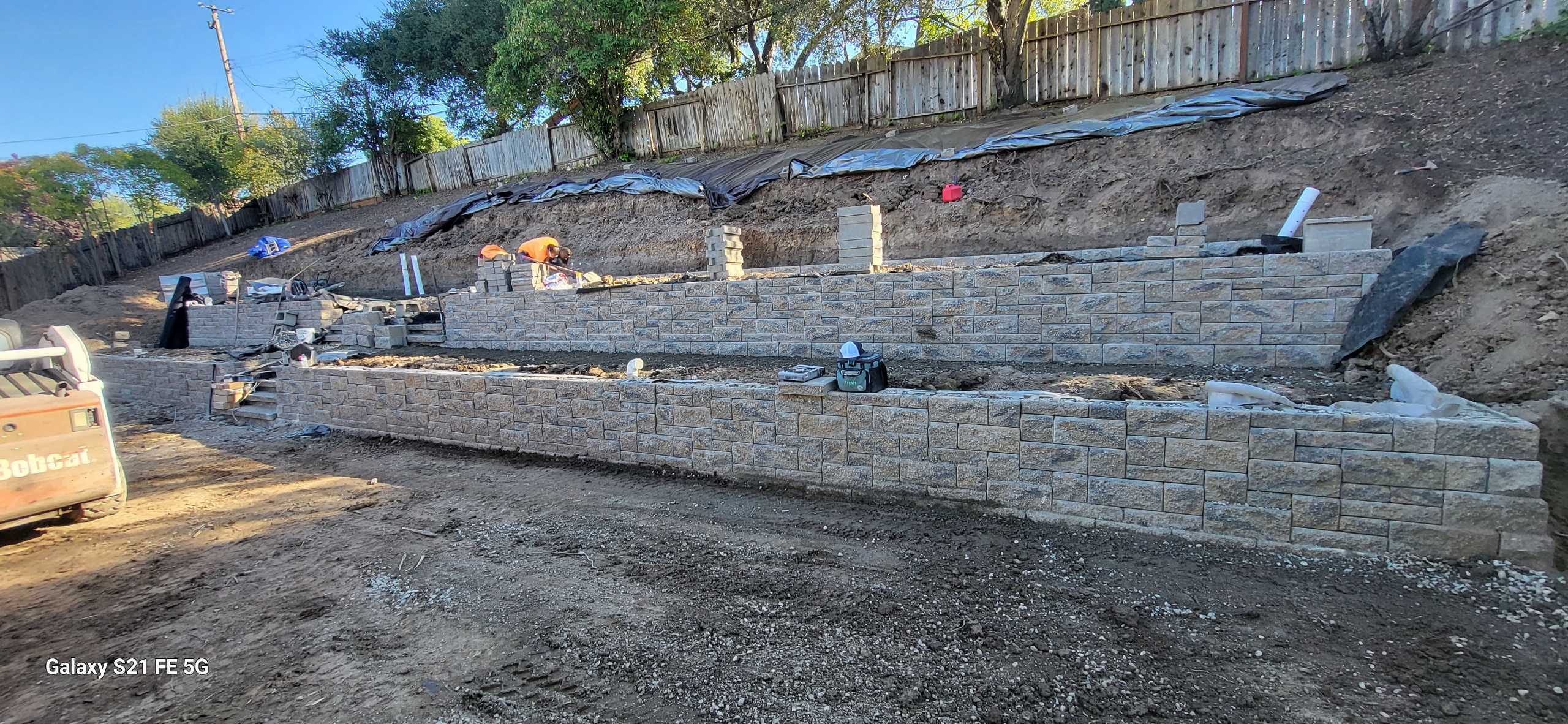 fg-pavers-and-turf-san-jose-retaining-walls-pavers-lighting-progress-102.jpg Terraced wall overview with cap progress.