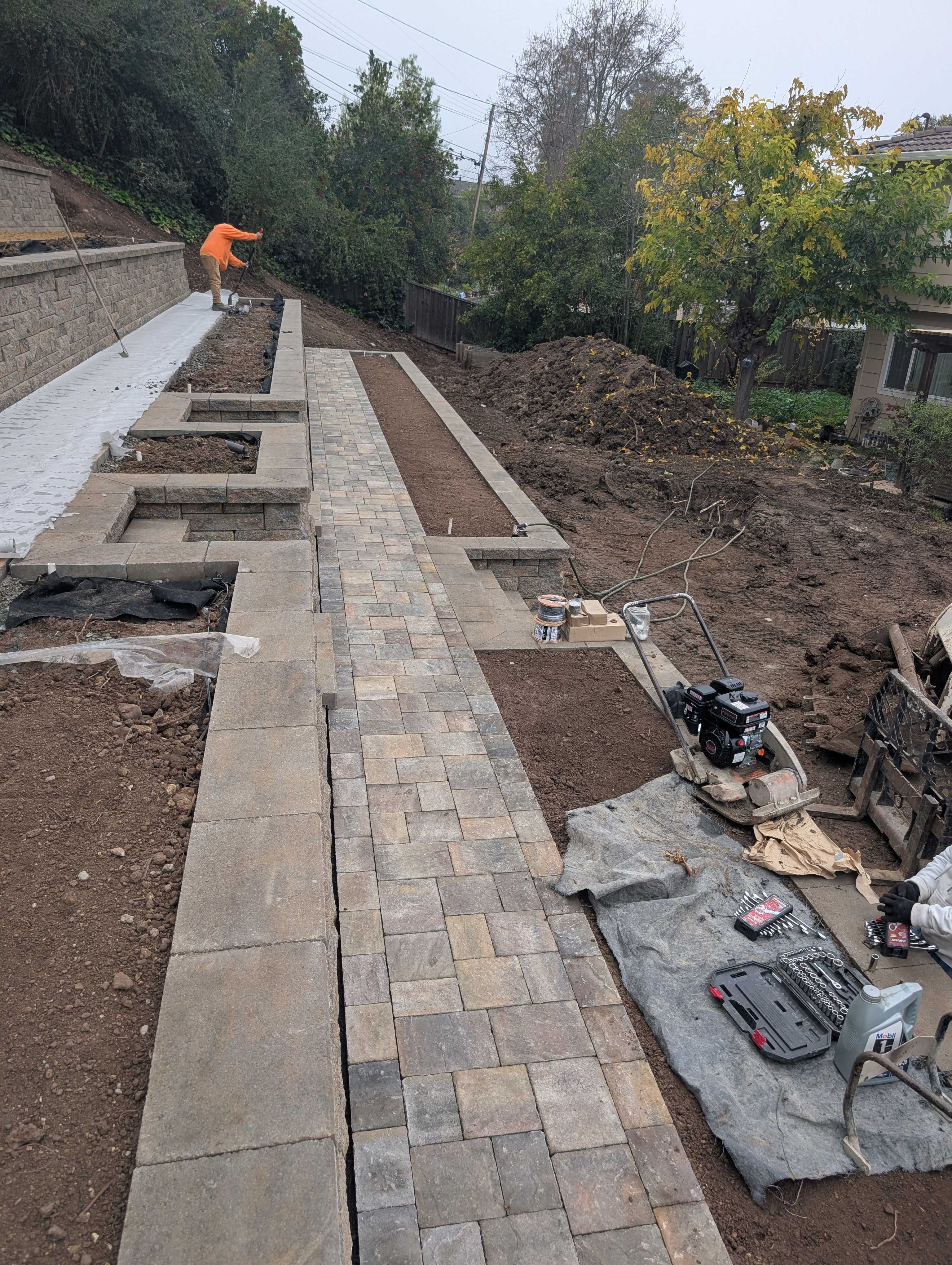 fg-pavers-and-turf-san-jose-retaining-walls-pavers-lighting-progress-159.jpg Evening wall and stair—lighting locations visible (progress).